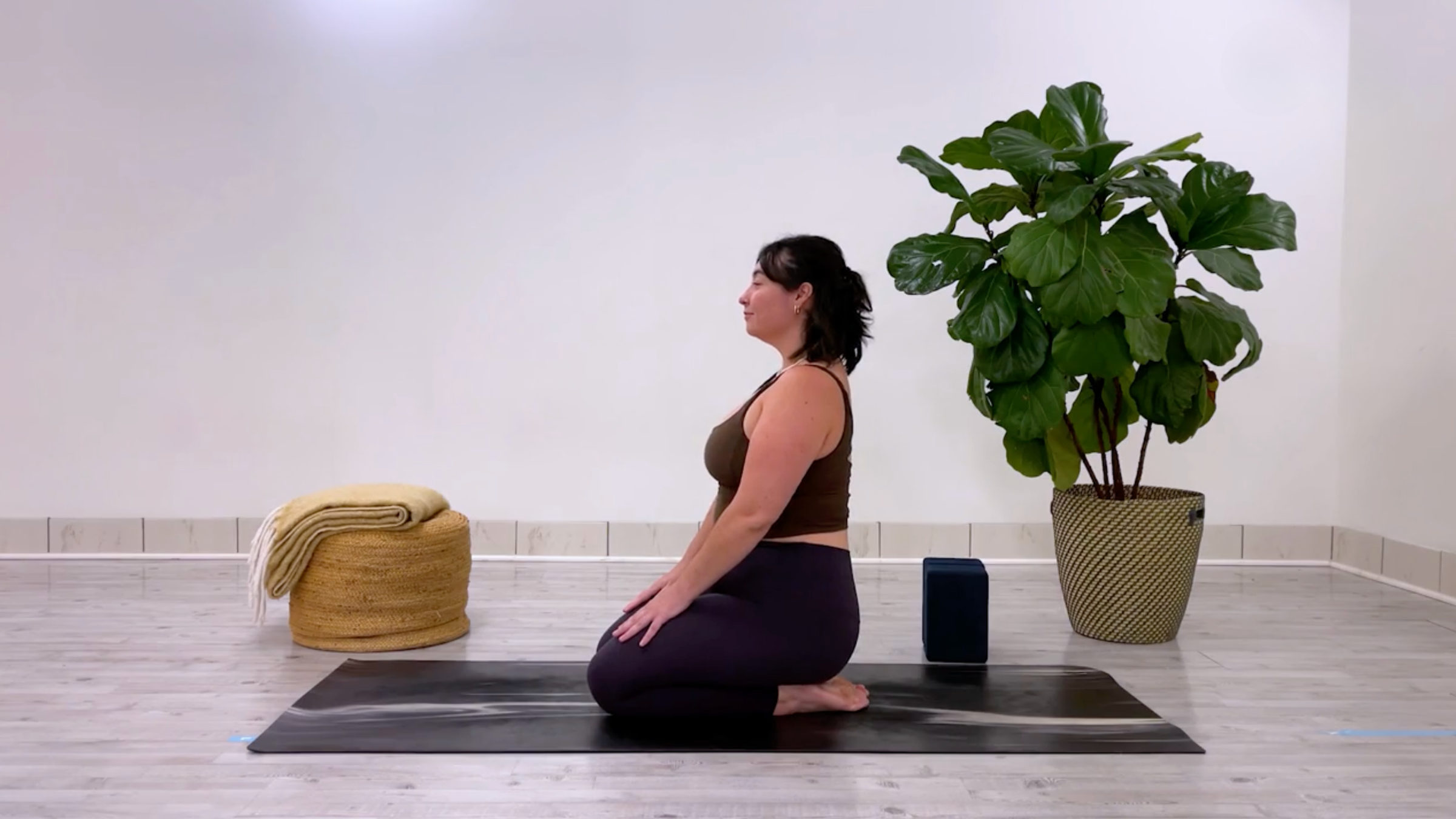 Yoga for better posture: teacher Taylor Lorenz in Thunderbolt Pose, or Vajrasana in Sanskrit